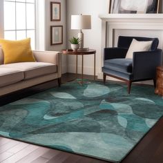 a living room filled with furniture and a rug on top of a hard wood floor