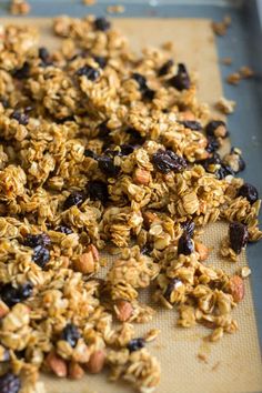 granola and raisins on a baking sheet