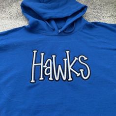 Perfect for all of your school activities. This listing is for one crewneck sweatshirt or hoodie that has your team name embroidered in an embossed print on the center front chest. So cute! It is embroidered using a puff technique giving it a 3D look. Available in Hawks, Wildcats, Panthers, Tigers, Eagles, Jackets, Cougars, Spartans, Hornets, Bulldogs, Wolves, Warriors, Pioneers, Bears, Dawgs, and Raiders.  If you don't see your Team Name, please let me know and I'll try to get it for you. This is the perfect  sweatshirt to wear to school and to all of your school activities or just because.  Please message me with your school mascot and I will make it for you!  Choose what color sweatshirt you would like and you'll have your new favorite sweatshirt in no time. Wash inside out. Do NOT put Name Sweatshirt, Color Sweatshirt, Spirit Shirts, Puff Print, Team Name, Embroidered Sweatshirt, School Mascot, Team Names, Embroidered Sweatshirts