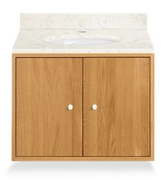 a wooden cabinet with a white sink and marble counter top on the left side, against a white background