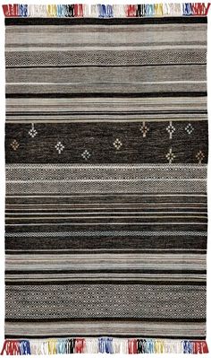 a multicolored striped area rug with fringes