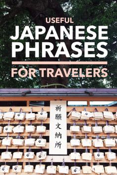 the japanese phrases for travelers are displayed on wooden crates