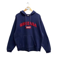 Code : p/630 Vintage 00s Gonzaga University Navy Hoodie Large Gonzaga Bulldogs Sweatshirt Gonzaga Sweater Pullover Spell Out Patches Logo Gonzaga Jumper Size on Tag : L Details Measurement  Arm Pit to Arm Pit : 25"inches Back Collar to Hem : 28"inches Condition :  Great Vintage Condition(used clothing.No Holes And No Stain.Please refer pictures detail.‼️ 90s Long Sleeve Winter Hoodie, 90s Hoodie Tops For Winter, Winter College Sweatshirt With Kangaroo Pocket, 90s Style Winter Sweatshirt With Drawstring Hood, Vintage Winter Tops With Drawstring Hood, Vintage Crew Neck Sweatshirt With Kangaroo Pocket, 90s Crew Neck Winter Hoodie, Vintage Sweatshirt With Kangaroo Pocket For Streetwear, Vintage Sweatshirt With Kangaroo Pocket For Fall