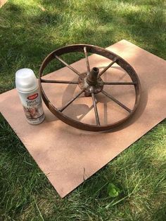 a wheel sitting on top of a piece of cloth next to a bottle of deodorant