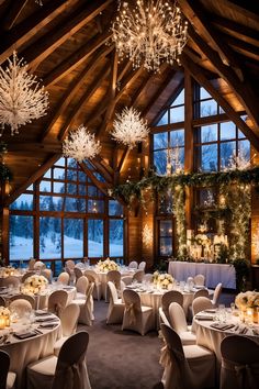 an indoor wedding venue with chandeliers and tables