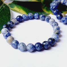 Welcome to Naturalgemstonespg Find Your Dream Gemstone Here. Authentic Sodalite Bracelet, Gemstone Bracelet, Beaded Bracelet ,Natural Sodalite 8MM Bracelet Handmade Jewelry Gift for Men's & Women's. About this item. Natural Sodalite Bracelet gemstone fashion Sodalite bracelets are perfect to wear with all of your casual outfitsThe stones are strung on sturdy elastic stretch cord. CRYSTAL HEALING MEANING: In crystal healing, Sodalite clears the Eye Chakra for Third mental balance. Sodalite is a stone of truth, enabling the conscious and subconscious mind to connect with one's thoughts and feelings, and helping one to recognize and verbalize those feelings and truths objectively. Description : Bracelet  Name           : Sodalite Colour                          : Blue Bead Shape Sodalite Round Beads Bracelets For Healing, Spiritual Sodalite Gemstone Beaded Bracelets, Handmade Sodalite Round Bead Bracelets, Sodalite Bracelet, Mental Balance, Bracelet Gemstone, Handmade Jewelry Gift, Bracelet Beaded, Subconscious Mind