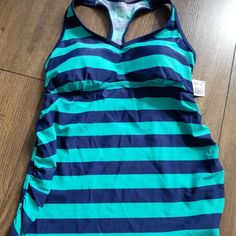 Nwt..Motherhood Maternity Razorback Swimsuit Top. Size M. Ruched Sides. Padded. Blue Racerback Tankini For Beach, Blue Racerback Tankini For Poolside, Blue One-piece Swimwear For Workout, Blue Stretch Tankini For Workout, Blue One-piece Tankini With Built-in Bra, Maternity Swim, Motherhood Maternity, Maternity Tops, Swimsuit Tops