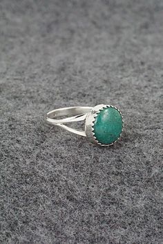 This turquoise and sterling silver ring was made by Navajo silversmith Robert Martinez. The inside of the band is stamped sterling.Size: 5.75Length: 3/8"Width: 3/8"Free shipping on all orders! We ship with USPS and always include tracking. All orders ship within a day of payment.Returns are accepted up to 30 days after you receive your order. Just send us a message. Our shop offers cash back or store credit. The item must be returned in new condition. Untreated Turquoise Sterling Silver Ring, Southwestern Sterling Silver Turquoise Ring, Southwestern Style Stamped 925 Turquoise Ring, Southwestern Style Turquoise Ring Stamped 925, Untreated Silver Turquoise Ring, Turquoise Emerald Ring Sterling Silver 925, Robert Martinez, Bear Carving, Pearl Chain