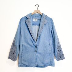 Peep This Truly Spectacular Vintage Gem Of A Denim Jacket. Literally Incredible. Fashioned By El Paso, Tx Legend, Lorraine Wardy, For Her Opal Line And Made In The Usa, This Beauty Is Packed With Vintage Charm. Soft Denim Jacket Material Takes An Oversized Blazer Shape And Slays With Crochet/Macrame Detailing On The Sleeves And Collar. She’s Truly Multifaceted And Is Sized As An Xs For A Super Slouchy Oversized Fit. This Jacket Could Definitely Fit Up To A Medium For A More Relaxed Look, But Could Still Fit A Large If You Like It More Fitted. Please See Measurements For Fit! Brand Name: Opal By Lorraine Wardy Market: Women’s, Vintage, Jackets, Shackets, Blazers Color: Blue, Denim Materi Vintage Long Sleeve Denim Jacket For Spring, Vintage Denim Jacket For Spring, Vintage Spring Denim Jacket, Spring Denim Blue Cotton Blazer, Vintage Oversized Outerwear For Spring, Retro Denim Outerwear For Spring, Denim Blue Cotton Blazer For Spring, Vintage Denim Blazer For Spring, Spring Medium Wash Cotton Blazer