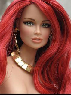 a doll with red hair and gold jewelry