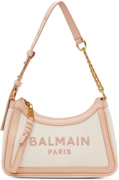 Canvas and buffed calfskin shoulder bag in off-white. · Adjustable curb chain shoulder strap · Logo embroidered at face · Zip closure · Card slot at interior · Twill lining · Logo-engraved gold-tone hardware · H4.75 x W9 x D3 Supplier color: Creme/Pink Balmain Clothing, Luxury Bags Collection, Plush Bags, Fancy Bags, Fire Fits, Curb Chain, Logo Embroidered, Sling Bag, Luxury Streetwear