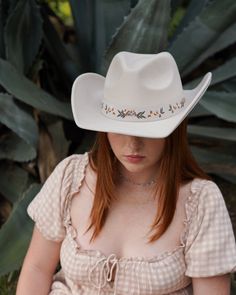 Add a touch of western glam to your outfit with our Cream Floral Embroidered Strap Cowboy Hat! This cute white cowboy hat features a strap embroidered with pretty flower details and pairs well with virtually anything. White Western Felt Hat For Kentucky Derby, White Western Felt Hat For The Beach, White Flat Brim Felt Hat For Spring, White Spring Felt Hat With Short Brim, White Western Hat For Spring, White Country Style Felt Hat For Beach, Country Style White Felt Hat For Beach, White Country Style Felt Hat For The Beach, Country Style White Felt Hat For The Beach