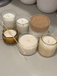 several different types of candles on a table