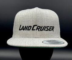 Toyota Land Cruiser logo embroidered on a flat brim structured baseball hat. The hat has a high profile and snapback closure. The hat is made with 80% acrylic and 20% wool. Our hats are embroidered in North Carolina in our studio. We can customize the Land Cruiser logo color for free. We can also customize the design for an upcharge. Please tell us at checkout if you want a different color logo or custom design. There are numerous hat colors available. Please see the color chart. The hat is a Yo Crown Heights, Color Logo, Snap Back, Snap Backs, Baseball Hat, Logo Color, Toyota Land Cruiser, Hat Cap, Land Cruiser