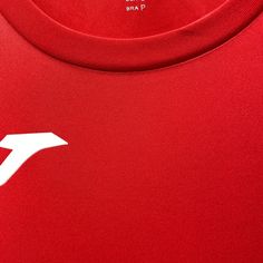 the back of a red shirt with white arrows on it's chest and bottom