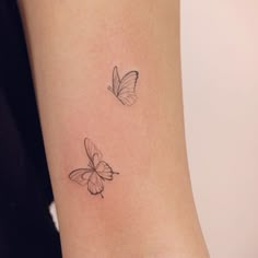 two small butterflies on the wrist