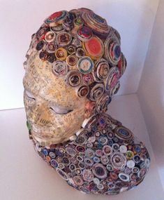 a hat made out of buttons and paper