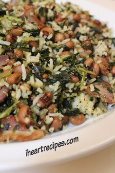 a white plate topped with rice and beans