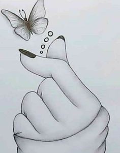 a drawing of a hand holding a butterfly