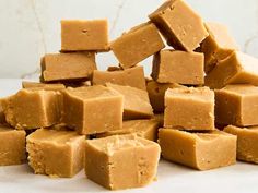 a pile of peanut butter fudges sitting on top of a table