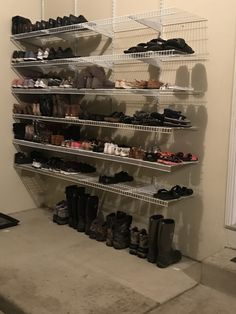 there are many pairs of shoes on the shelves