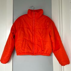 Brand: New Look Size: L Color: Orange Puffer Jacket With Collar, Zipper And Pockets Made In China Material: Shell - 100% Polyester, Backing - Pa Coating, Lining - 100% Polyester, Filling - 100% Polyester Machine Wash Measurements: 19” Front Center Length, 20.5” Back Center Length, 23” Sleeve Length, 19” Shoulder To Shoulder, 24” Armpit To Armpit Retail Price: $79 Condition: New With Tags Casual Puffer Outerwear For Work, Spring Outdoor Puffer Jacket, Sporty Spring Puffer Outerwear, Casual Hooded Puffer Jacket For Work, Casual Workwear Puffer Jacket, Spring Hooded Puffer Jacket For Workwear, Red Casual Puffer Jacket For Spring, Orange Hooded Outerwear For Spring, Casual Spring Puffer Jacket For Work