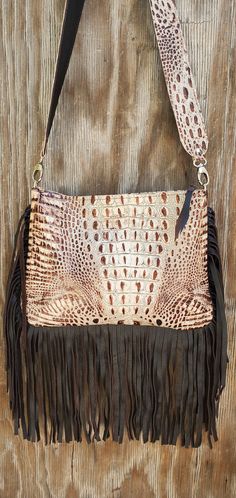 "Made of extremely soft genuine leather Leather fringe along the bottom and sides 1 pocket inside - 1 pocket outside Zipper closure for the entire purse 2\" wide leather strap  Extremely light weight Purse measures approx: 12″ L x 9″ H - laying flat Last photo is for size reference only" Leather Fringe Handbag, Fringe Handbags, Cross Body Purse, Western Leather, Leather Fringe, Embossed Leather, Rodeo, Cross Body Handbags, Purses Crossbody