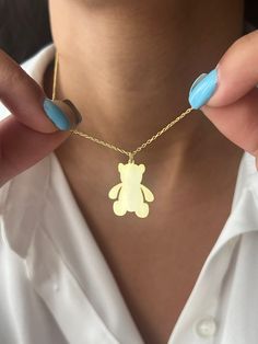 Cute teddy bear for her or for him🧸  Get this beautiful minimalist jewelry made with the quality of perfect elements✨ You can choose 925K Sterling Silver with the options of Gold, Rose Gold or White Gold colors. High quality jewelry for everyone 🤍  Details * 925K Sterling Silver Option → 14K Gold, Rose Gold or White Gold plated * Chain length is approximately either 18 inches / 45 cm or 22 inches / 55 cm 18 inches (16+2 in extender) / 45 cm (40+5 cm extender) 22 inches (20+2 in extender) / 55 cm (50+5 cm extender) * Time is everything! You will receive your package as soon as possible 🚚  * We care about the quality of metal to make sure it will last for a long time * We use enamel technique to color the jewelry and high quality zircons only * There can be tiny differences on each item. Teddy Bear Necklace, Teddy Bear Gift, Man Jewelry, Teddy Bear Gifts, Bear Necklace, Bear Pendant, Gift For Daughter, Christmas Jewelry, Gold Plated Chains