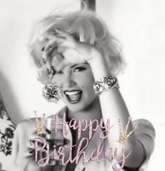 a black and white photo of a woman holding her hair in the air with happy birthday written on it