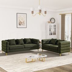 a living room with two green couches and a coffee table