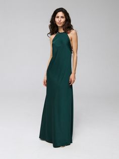 a woman in a long green dress