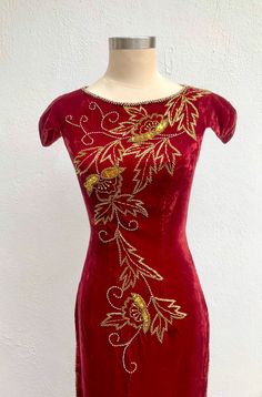 Velvet Fitted Wedding Gown, Fitted Velvet Wedding Gown, Fitted Red Velvet Floor-length Dress, Red Fitted Floor-length Velvet Dress, Fitted Floor-length Red Velvet Dress, Burgundy Velvet Dress For Wedding, Fitted Velvet Embellished Evening Dress, Fitted Holiday Gown For Festive Occasion, Festive Fitted Gown With Gold Embroidery