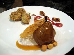 a white plate topped with food on top of a table