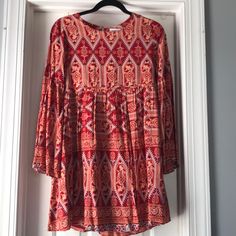 100% Rayon Patterned Bell Sleeve Dress. Never Worn. Fully Lined. Keyhole Button Enclosure At Back Of Neck. Approximate Measurements Laying Flat Bust 34” Length 33”. Casual Red Midi Dress For Dress Down Occasion, Casual Red Midi Dress For Dress Down Days, Red Casual Midi Dress, Casual Long Sleeve Patterned Mini Dress, Chic Red Rayon Dress, Red Buttoned Dress For Day Out, Red Button Dress For Day Out, Casual Red Dresses For Dress Down Occasions, Red Bohemian Mini Dress For Brunch