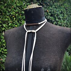 "-With 50\" of soft deerskin leather and adjustable ties, this versatile wrap choker can be worn so many ways: -Doubled lariat with ties in front -Choker tied in back with long tails down the back -Choker tied in front with long tails down the chest -Triple wrap choker tied in back with short tails -Triple wrap choker tied in front with short tails -Wrist wrap -Ankle wrap -Upper arm wrap -Headband -Hatband -Belt -Center piece is a curved antique-copper bar. Can be worn in front or back of neck d Chic Handmade Adjustable Choker, Chic Adjustable Lariat Choker Necklace, Chic Lariat Necklace With Adjustable Length, Adjustable White Choker For Everyday Wear, Everyday Adjustable White Choker, Wrap Headband, Copper Bar, Different Hats, Wrist Wrap