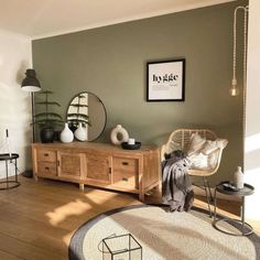 a living room filled with furniture and decor on top of hard wood floored floors