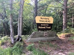 there is a sign in the woods that says, trailhead manistee national forest