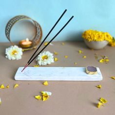 a table topped with yellow flowers and candles