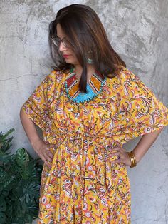 I have a deep fondness for making kaftans as they offer unparalleled comfort. This particular one is crafted with hand block printed cotton, adding a touch of uniqueness. This particular style features a drawstring waist, providing a flexible fit that accommodates up to 4xl sizes. If you need it to be maternity-friendly or nursing-friendly, I can add buttons in the front. You have the option to choose this feature at the time of checkout.  You also have the option to add pockets for an additional charge of $5. Kindly select this option during the checkout process. The best part is that it fits everyone perfectly, so you don't need to worry about sizes.  The shown length is ankle length, but I can customise it to knee or calf-length based on your height. You can select this option during ch Traditional Yellow Kaftan With Floral Print, Yellow Bohemian Kaftan With Printed Motifs, Cotton Kaftan With Ikat Print, Traditional Yellow Cotton Kaftan, Bohemian Cotton Kaftan With Block Print, Bohemian Cotton Block Print Kaftan, Bohemian Yellow Kaftan With Batik Print, Festival Cotton Block Print Kaftan, Multicolor Block Print Tunic Kaftan