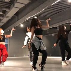 several young women are dancing in a dance studio