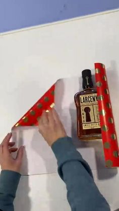 Christmas Gift Bottle Ideas, Alcohol Bottle Wrapping Ideas, Beer Wrapping Ideas, Wrapping A Liquor Bottle Gift Ideas, Booze Gifts Christmas, How To Gift Wrap A Bottle Of Alcohol, Gift Wrap Liquor Bottle Ideas, How To Wrap Alcohol Gift, Alcohol Gift Wrapping Ideas