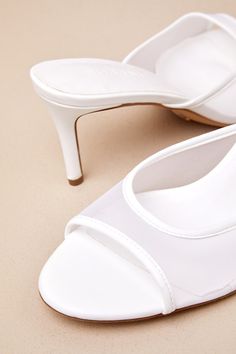 The Billini Ishi White Mesh High Heel Slide Sandals are an elegant and timeless look that'll elevate any 'fit! Smooth faux leather shapes a rounded footbed with a tapered, sheer mesh vamp with a low-cut collar. The effortless slide-on design completes the mule-style silhouette, all atop a flirty stiletto heel. Available in whole sizes only. 3" wrapped stiletto heel. Cushioned insole. Rubber sole has nonskid markings. Man Made Materials. Imported. Lulus | Ishi White Mesh High Heel Slide Sandal Heels | Size 7. Sheer Clothing, Sandal Heels, White Mesh, Stiletto Heel, Slide Sandals, Low Cut, High Heel, Stiletto Heels, Rubber Sole