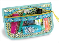 the inside of a purse with various items in it, including toothbrushes and lotion