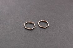 Small hexagon hoop earrings handcrafted with your choice of 14k gold filled, 14k rose gold fied, sterling silver, or argentium silver wire. A minimalistic piece that is safe for sensitive skin. * sold as a pair or a single piece 𝑔𝑜𝓁𝒹 𝒻𝒾𝓁𝓁 14k gold fill jewelry is an excellent choice for those seeking both quality and affordability. Crafted by bonding a thick layer of 14-karat gold to a base metal core, it offers the luxurious look of solid gold without the high price tag. This makes it a Handmade 14k Gold Minimalist Huggie Earrings, Simple Rose Gold Huggie Jewelry, Simple Small Hoop Rose Gold Jewelry, Modern Rose Gold Cartilage Earrings For Gift, Simple Rose Gold Small Hoop Jewelry, Handmade Minimalist 14k Gold Huggie Earrings, Minimalist Small Hoop Rose Gold Jewelry, Handmade Minimalist Huggie Earrings, Minimalist 14k Rose Gold Filled Cartilage Earrings