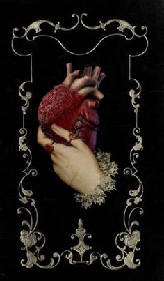 an altered photograph of a human heart in the middle of a frame with filigrees