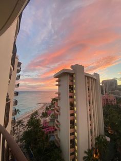 the sunset is setting over an oceanfront hotel and beach front buildings in waikiki, oahu