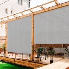 an outdoor patio with white shades on it