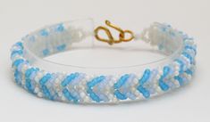 Chinese and Italian glass seed beads in a stacked chevron pattern with a gold-plated S hook clasp. This item can be customized for color or length.  Please contact me with your details, I'd love to help! Blue Chevron Bracelet, Bracelet Chevron, Chevron Bracelet, Bead Loom Bracelets, S Hook, Blue Chevron, Loom Bracelets, Hook Clasp, Glass Seed Beads