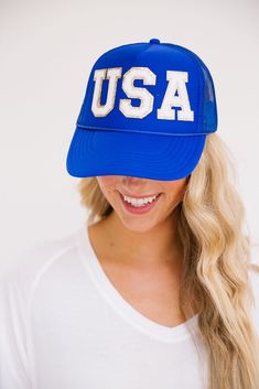 This USA hat is perfect for showing your American pride and spirit at the beach, gym, a hike, or just to cover up a bad hair day. The smiley face patch on the side is sure to put a smile on your face as well! Trucker Hat Product details: Snapback style Ponytail opening Mesh in the back of hat 100% Polyester All orders are currently shipping within 14 business days. To receive item quicker, expedited shipping is available at checkout. Blue Trucker Hat With Letter Print And Curved Brim, Blue Trucker Hat For Outdoor Activities, Blue Baseball Cap With Letter Patch And Curved Brim, Blue Trucker Hat With Letter Print, Blue Baseball Cap With Letter Patch, Blue Snapback Trucker Hat With Letter Print, Fun Blue Trucker Hat For Outdoor, Casual Blue Trucker Hat With Letter Print, Blue Adjustable Trucker Hat For Baseball Season