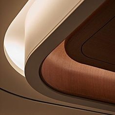 the interior of an airplane with wood and white trim on the ceiling, looking down at the floor